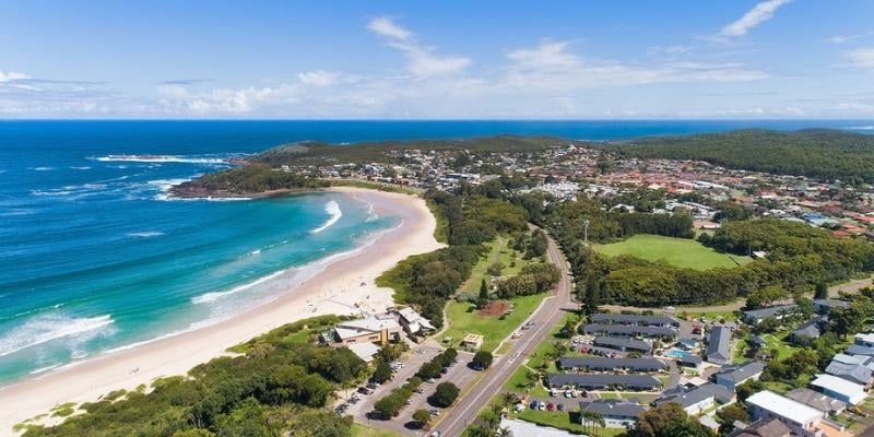 Story-based intervention - My Holiday at Seaside Holiday Resort in Fingal Bay  -  Aerial view of resort across from Fingal Beach and the Surf Life Saving Club looking south 