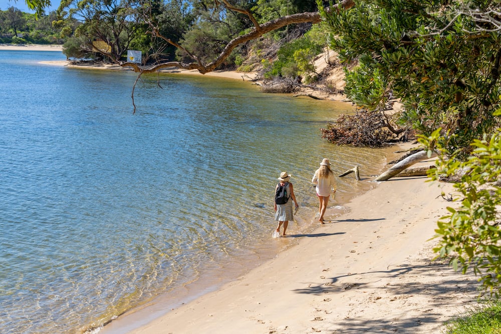 Sussex Inlet people walking beach at Haven Holiday Resort